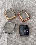 Four square-shaped phone case covers on a textured gray surface