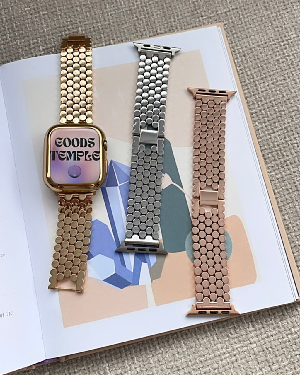 Three watch bands on a magazine with a textured surface background