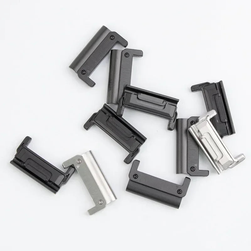Set of black and silver metal brackets on a white background