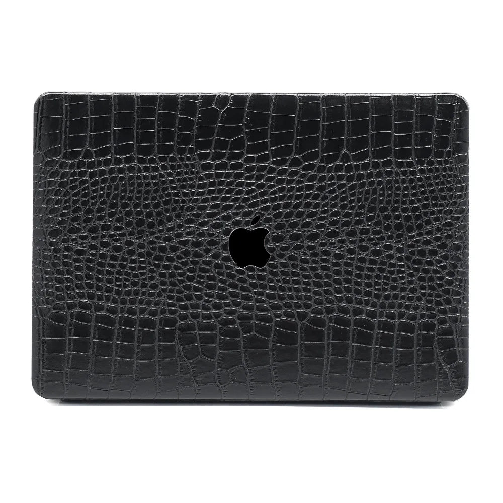 Black crocodile texture laptop case with Apple logo on a white background