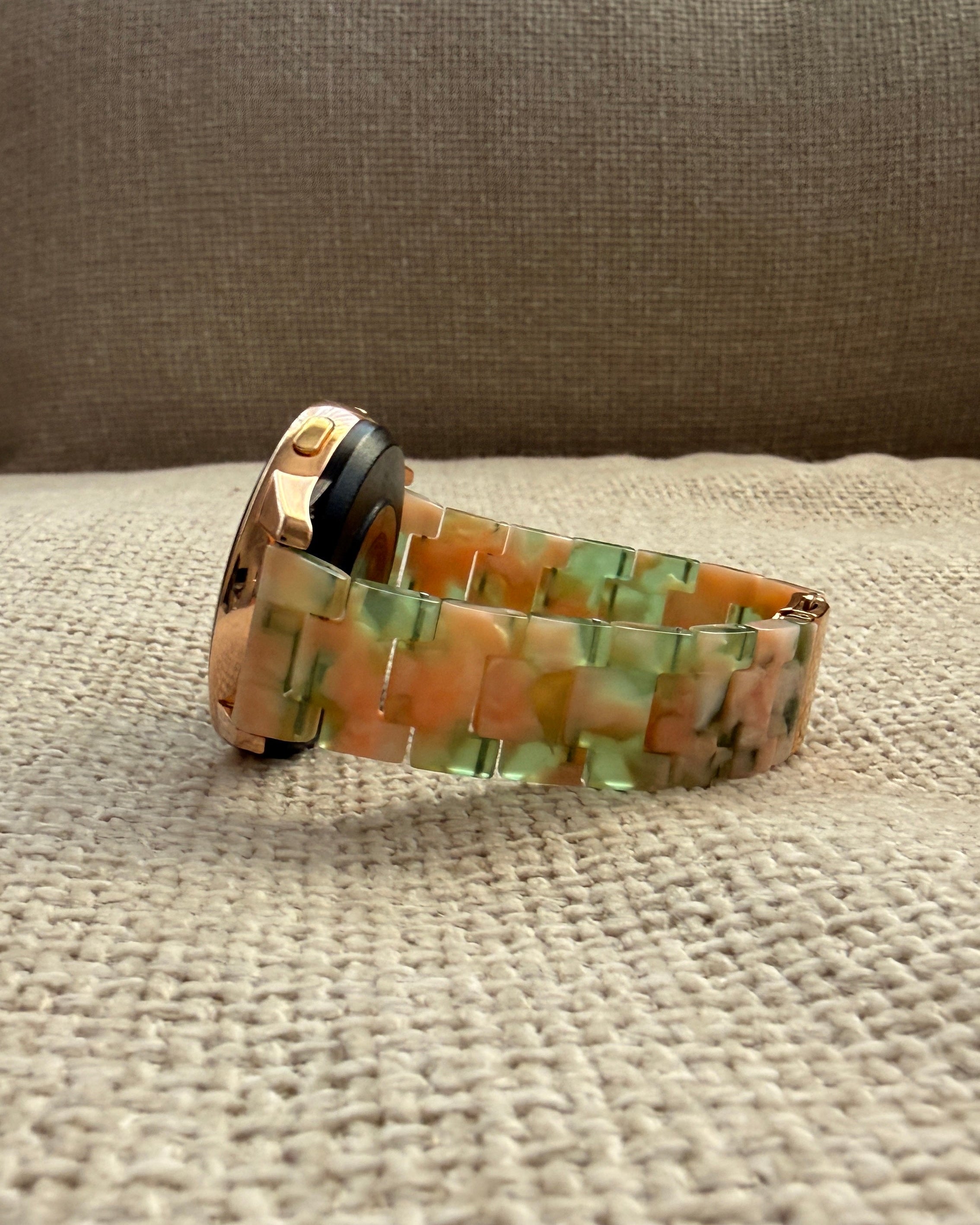 Watch band with a camouflage pattern on a textured surface