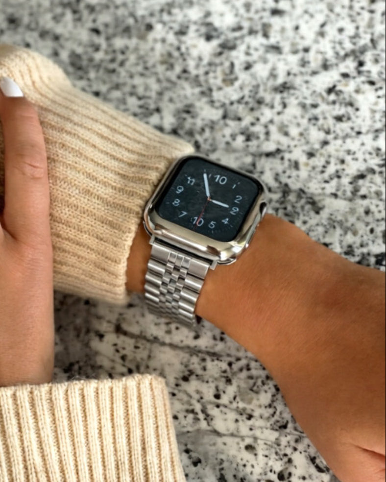 wearing a Silver Jubilee apple watch on a stone bench